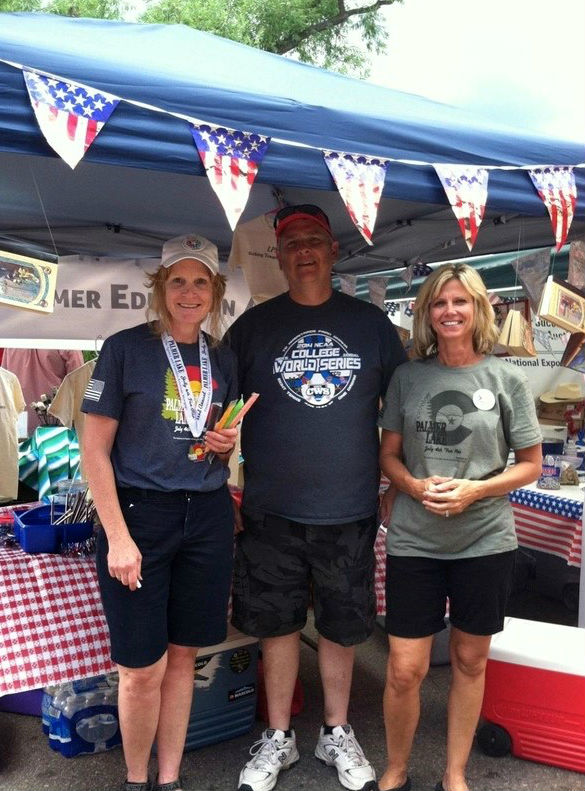 Lewis-Palmer District 38 Board of Education President Mark Pfoff poses for a photo at a July 4 event with Lewis Palmer Education Association members Char Armstrong and Rhonda Miller. Parents in the district accuse Pfoff of being in the LPEA's backpocket.