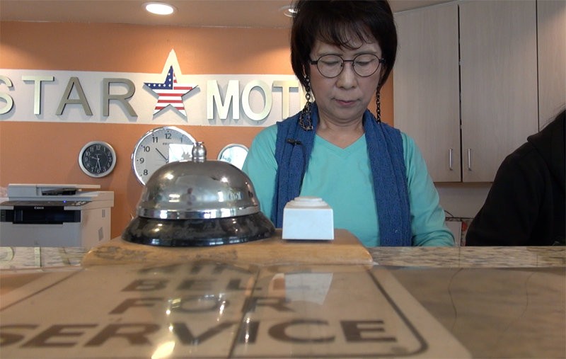Mrs. Soon Pak runs the front desk at her business, Star Motel - Credit: Todd Shepherd