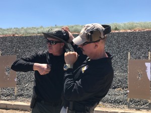 Two instructors from Tactical Defense Institute, which developed the FASTER curriculum, demonstrate close contact with a shooter. Photo by: Sherrie Peif