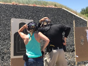 An instructor works with an unidentified woman on close range shooting during FASTER training. Photo by Sherrie Peif