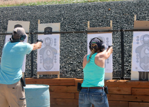 Ronnie Wilson, left, and an unidentified woman practice shooting skills during he FASTER training. 