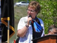 Weld County Commissioner Chairwoman Julie Cozad emcees a Vietnam Veteran's Pinning Ceremony earlier this year. Cozad is under investigation for violating Article XXIX of the Colorado Constitution.