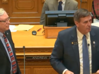 Senator John Cooke, right, on the Senate floor asking for HB 19-1172 be read in its entirety.