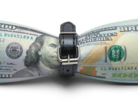 Cash Money being Tightened with Belt Isolated on White Background.